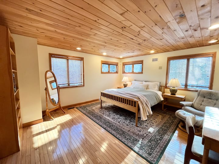 Guest bedroom with medium firmness queen sized mattress.