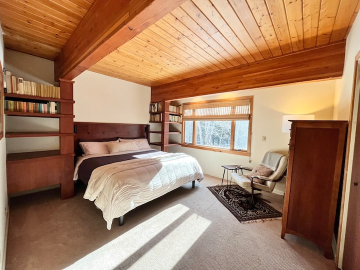 Guest bedroom with medium firmness king sized mattress.