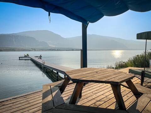 Lakefront + beach + dock. Sleeps 8. Close to town.