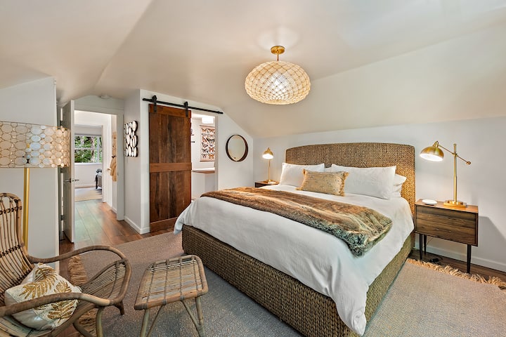 Retreat to luxury in our second-floor master bedroom, featuring a spacious king size bed for the ultimate comfort.  Enjoy restful sleep with room darkening shades and amenities of an iPhone charging cable and a JBL blue tooth speaker at arm's reach.