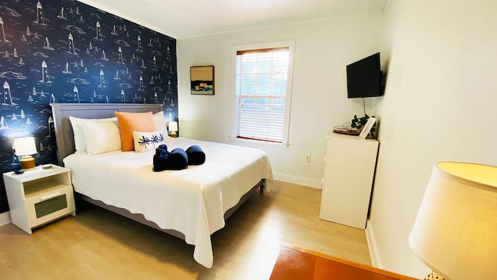 Downstairs bedroom with a queen bed.