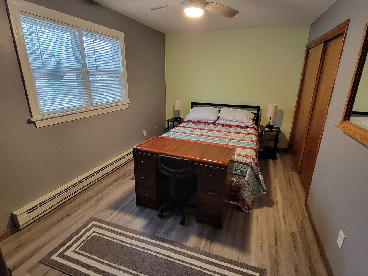 Master bedroom with a queen size bed. Sleeps up to two.  Both bedside lamps are equipped with USB plugs for easy charging. 