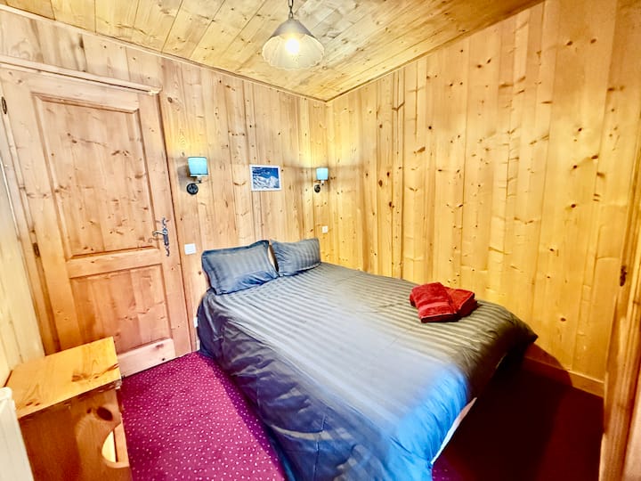 First double bedroom of the apartment  (140x190 bed) with desk and laundry access - ground floor