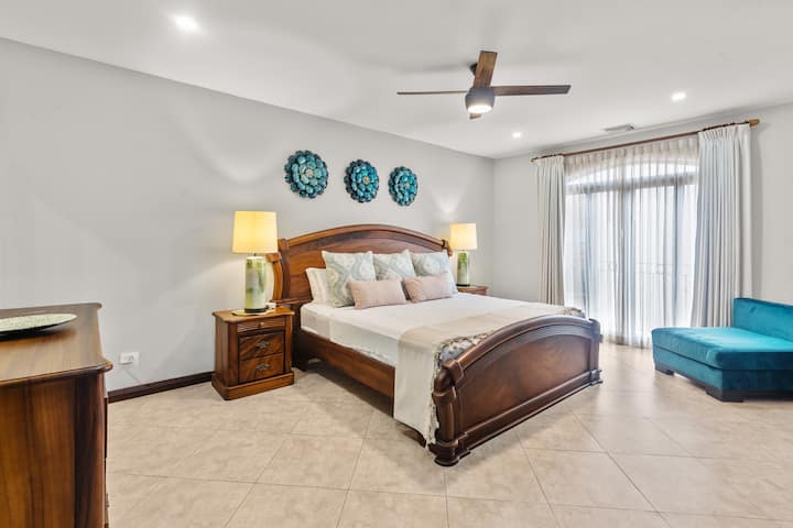 Large master bedroom with luxurious king size bed. High quality brand new mattress, pillows and linens