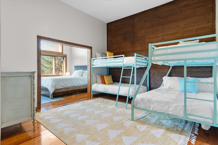 Our kids' favorite!! This bedroom features two sets of bunks (3 twin and one full bed). This room is open to Bedroom 5 (queen) making it perfect for the kids or a family. There is a full bathroom with shower in the hallway just outside of this room.