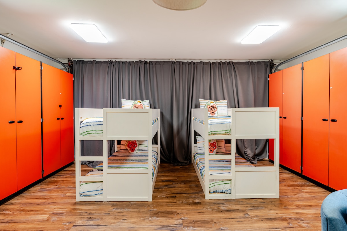 Cozy bunk beds with elementary school cabinets vibe.  