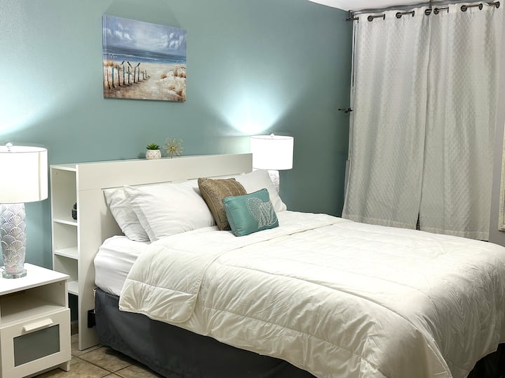 Master Bedroom- features a queen-sized bed, a desk, a full-size sofa bed, and a private bathroom.