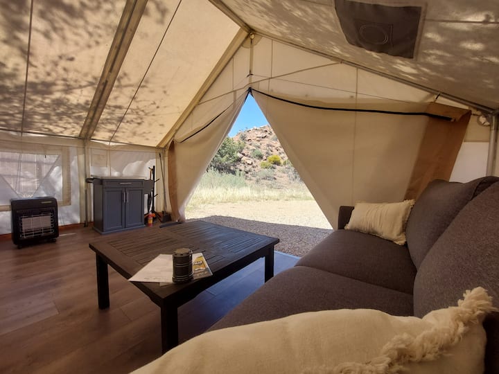 Our most private site. Your tent faces the iconic Palisade rock formation. Enjoy the view from your private wood chiminea and outdoor space that has a BBQ grill, picnic table and hammock.