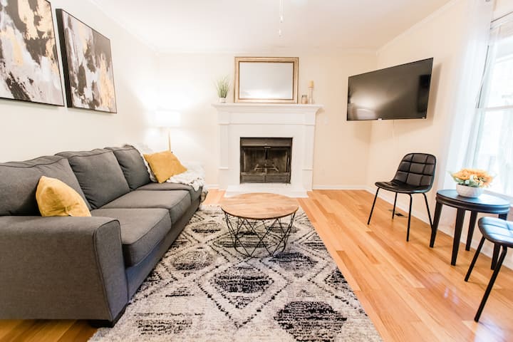 Your cozy living room with a new 50 inch Roku smart TV and a wood burning fireplace.  There's now another sitting chair for more seating. 

"The home is very spacious and clean, I would definitely stay again." -Brittany, Raleigh, NC