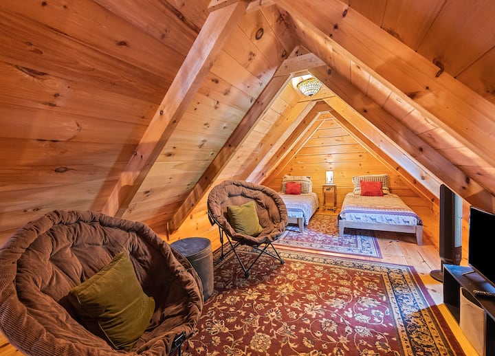 Our inviting loft, with its two twin beds, two comfortable chairs, and a TV, is the perfect space for kids to have their own fun and relaxation time during your stay. PLEASE NOTE THAT OUR LOFT CAN ONLY BE ACCESSED VIA A SPIRAL STAIRCASE.  