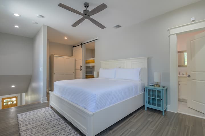 Upstairs loft with king bed, own bathroom, and smart TV