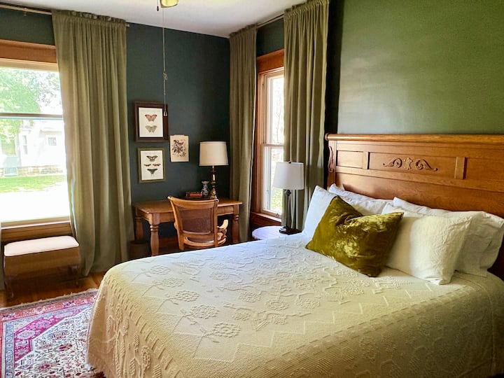 First floor bedroom with queen bed. Sliding door provides privacy.