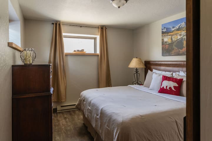 second bedroom in basement w/ king size bed