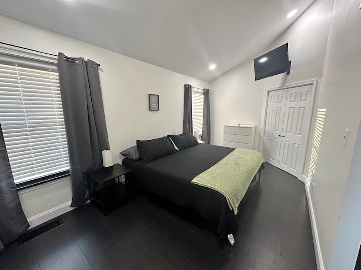 Master Bedroom #1 with King Bed, Smart TV, dresser & Closet