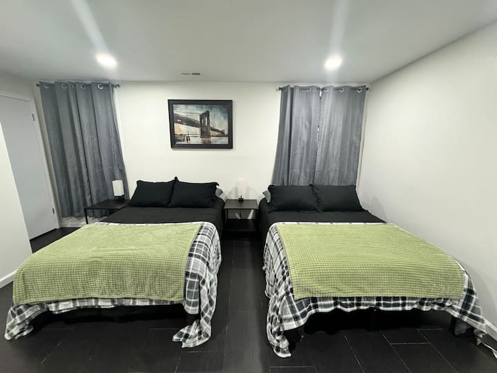 Bedroom #5 with 2 Full Size Beds, Smart TV, Dresser and Closet.