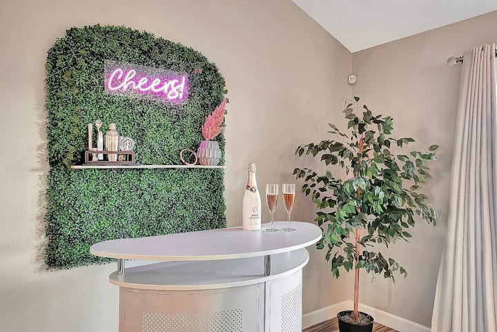 Here's perfect photo spot with chic plant wall in front of neon Cheers sign!

How about a champagne to celebrate your stay?