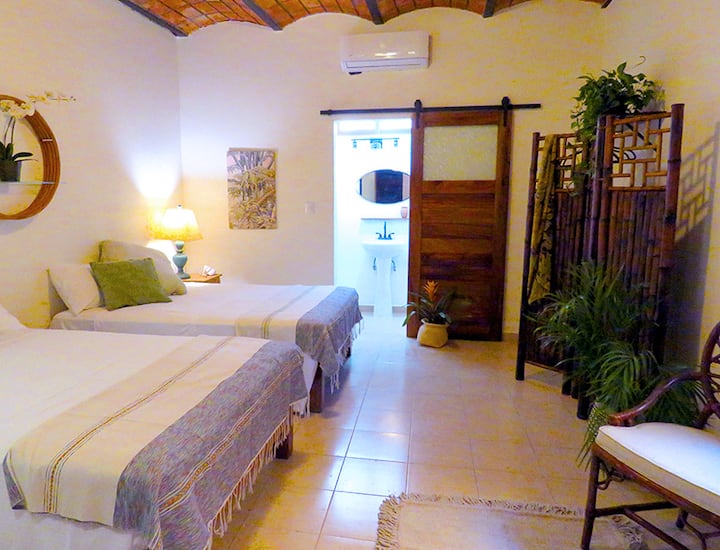 Spacious Bambu has two full size beds and room to spread out. Also a desk for working.