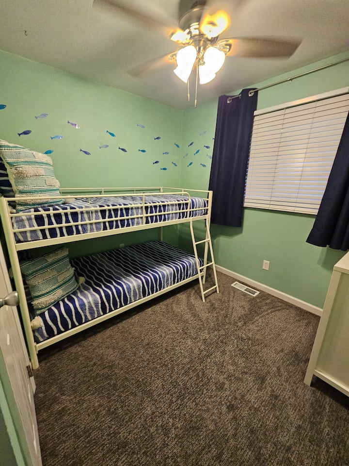 Twin over twin bunk and TV. Dresser and closet 