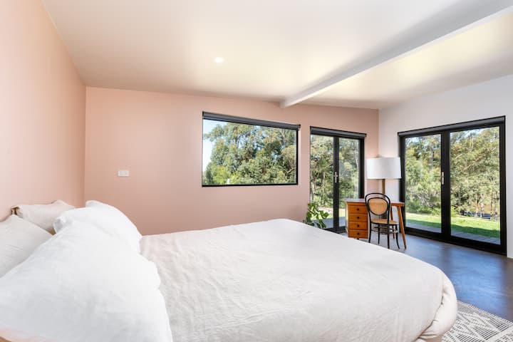Sleep 6 inside and more outside if you are game. In a generous main bedroom, look out over the orchard to towering gums from your queen size bed. Two private double beds are located in rooms down the corridor