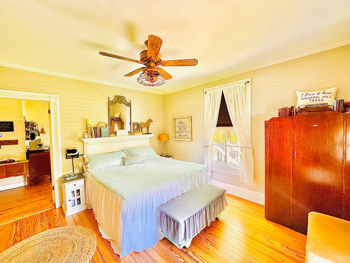 Bedroom overlooks pond area/backyard. King bed, black-out shades, phone chargers, eye masks, Smart TV (w/remote + streaming options).  Linens provided. NOT pictured: fireplace w/remote, ensuite bathroom (see bathroom pics).  