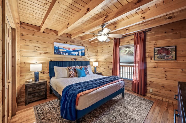 Downstairs master bedroom with a king size bed and 40" Roku TV