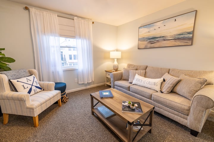 Comfortable living with plenty of seating and sunlight.  Black out blinds provide the perfect atmosphere for movie watching and privacy. 