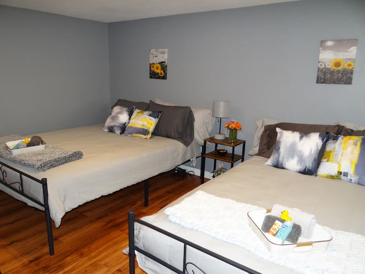 Two comfortable queen beds sit side by side. The room is great for kids or big enough for 2 couples. The half bath is connected to this room.