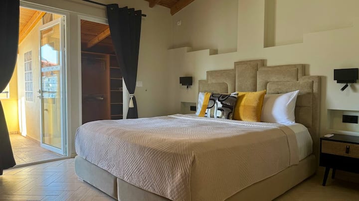 Bedroom 1 includes a King size bed (180 x 200cm), an ensuite bathroom, a walk-in closet, a dressing table, and access to the office. 