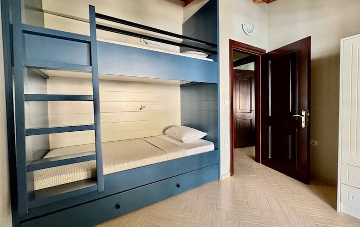 Bedroom 3 includes bunk beds (105 x 202cm) plus an additional pull out bed (98 x 193). There's also a closet and access to the side balcony. 