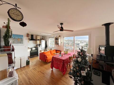 House with view of valley and sea in the distance