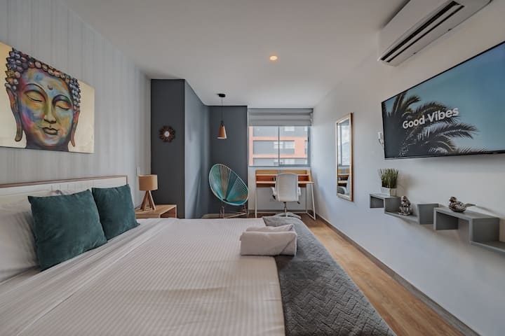 The master bedroom blends modern design and elegance. It features a plush bed, two nightstands, and a sleek desk, creating a stylish and comfortable space for rest, work, and relaxation.