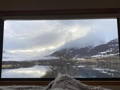 Lake, mountain and huemules from your window