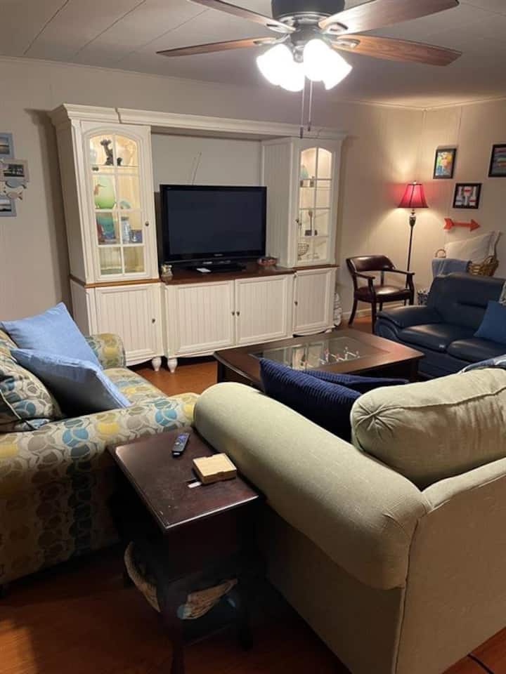Entertainment center, ROKU TV with Disney streaming.  Available WiFi streaming capabilities. Cool, central air conditioning for breaks from the lake sun.