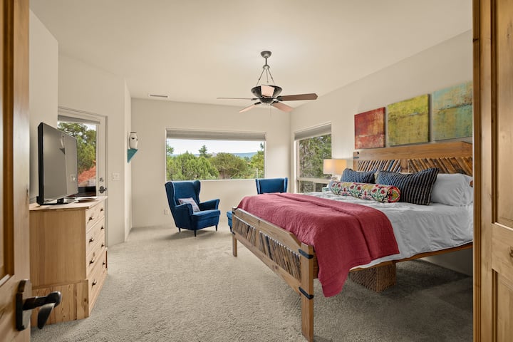 Entrance to master suite with blackout shades, TV, and views.