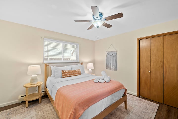 Primary bedroom with ensuite bathroom, queen bed with high-quality bedding