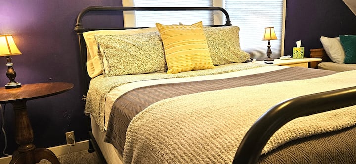 One queen bed and daybed are in the loft 