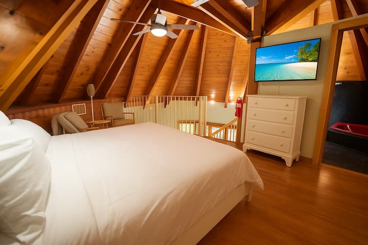 Upstairs loft bedroom with King size bed, and sitting area. 