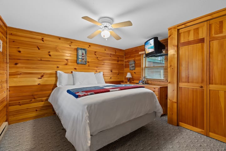 Bedroom in “Bohn” cabin. This is the only bedroom in Bohn cabin. It has a queen bed.