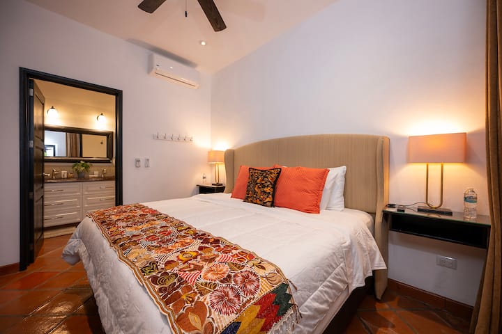 Primary bedroom #1 located on first floor for easy access. Features include; High quality King bed with plush bedding, large closet for storage, flat screen TV, safety box, reverse heat/AC unit, ceiling fan, soundproof window and en-suite bathroom.