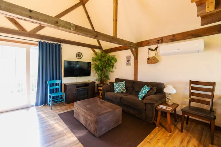 The electric fireplace in the living room creates ambiance  and comfortable seating creates a restful and relaxed environment.