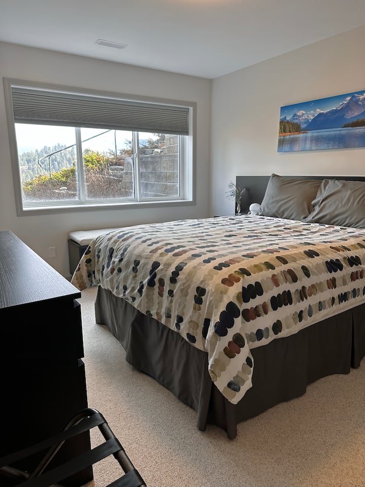 Comfy queen size bed with a selection of pillows. 