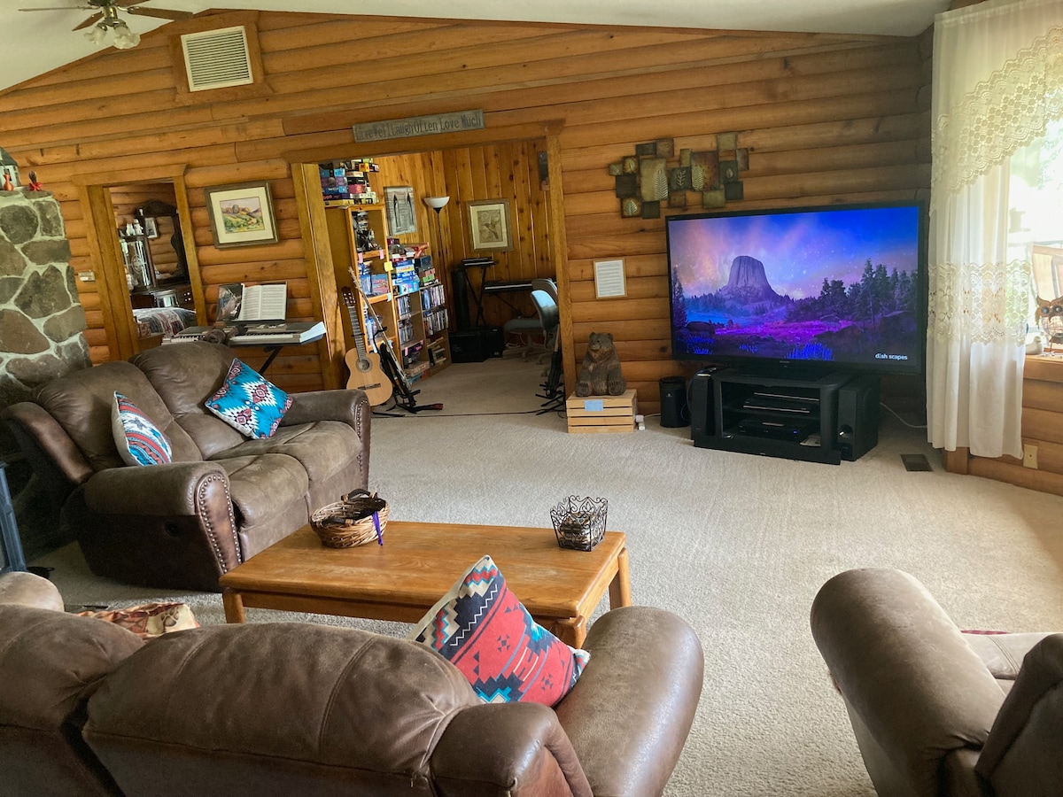 Plenty of room in the living room with a music room in the background.