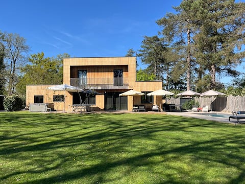 Wooden house designed by an architect, spa pool