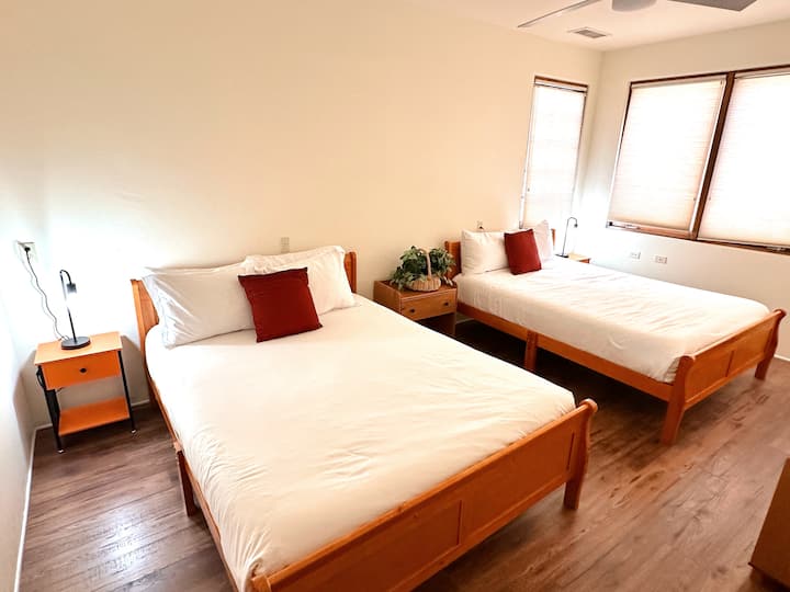 This bedroom features two cozy queen-size beds —perfect for families or groups. While there’s no closet, the room is equipped with convenient luggage racks for your storage needs.