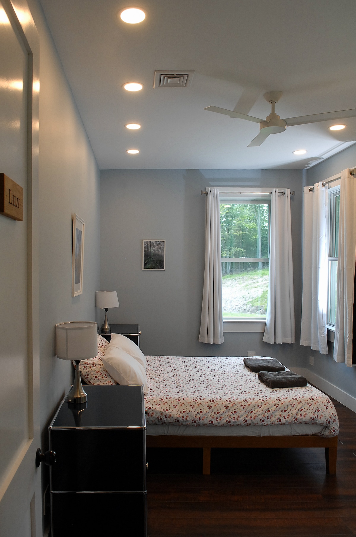 Bedroom #6, queen bed, peaceful view of the back yard and woods. 