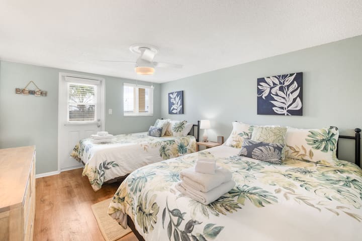 Second Bedroom: Guests can enjoy two queen-size beds with a door to the exterior making this a great option for guests who need elevator access. 
