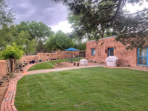 Peaceful artisan adobe with view of the Sandias