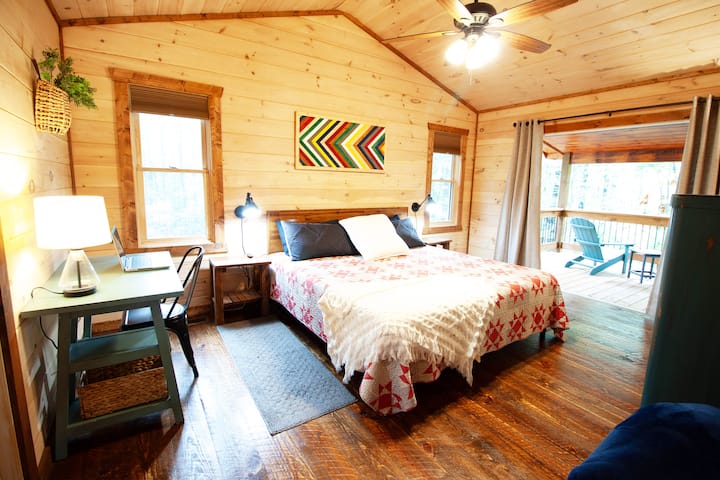 This upper level bedroom has the best view in the house. The 3rd floor balcony is a perfect spot to have a morning coffee or an evening beverage. The 65" TV will provide the streaming entertainment and the amazing king bed will help you rest.