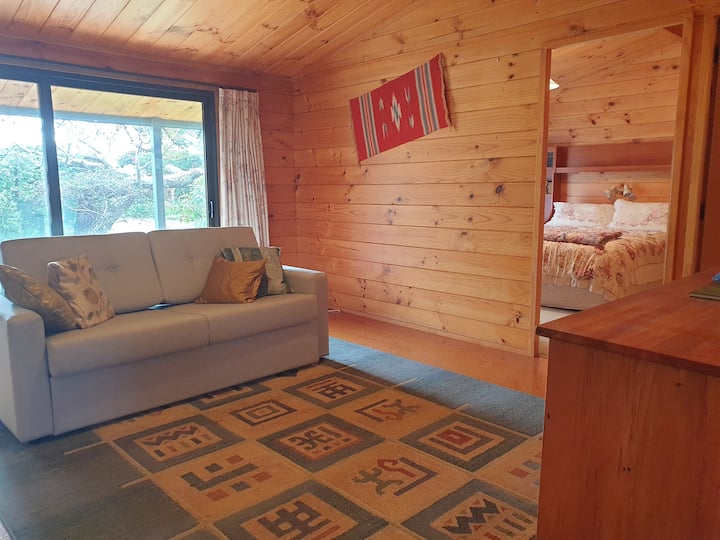 Family room or second lounge with a Queen Sofa bed and it's own smart television and a DVD player. This family room also opens with sliding doors onto the main patio area.