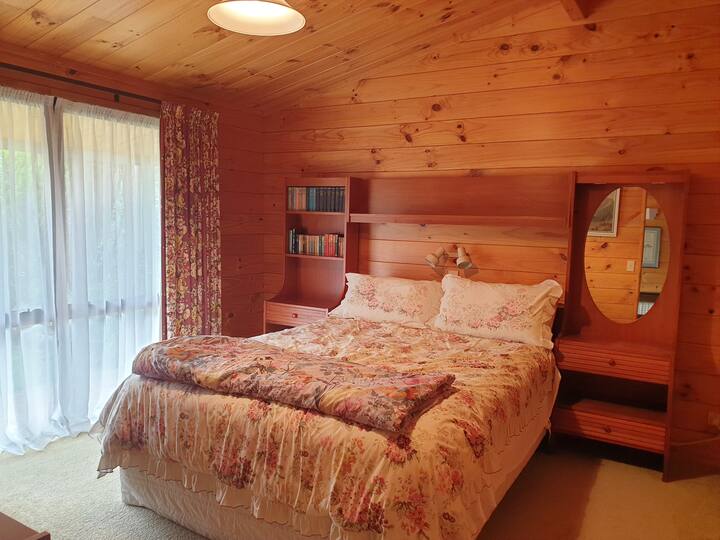 Large bedroom with new Queen bed and large wardrobe. Plenty of draw space with a low boy dresser in the room.